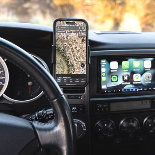 Image of Offroam Phone Mount installed securely in Toyota 4Runner 2003-2009. This premium phone mount installs easily without drilling or glue. Spring loaded Universal holder for use with any phone. Perfect placement without blocking screens, driver view, or air flow. Fully adjustable positioning.
