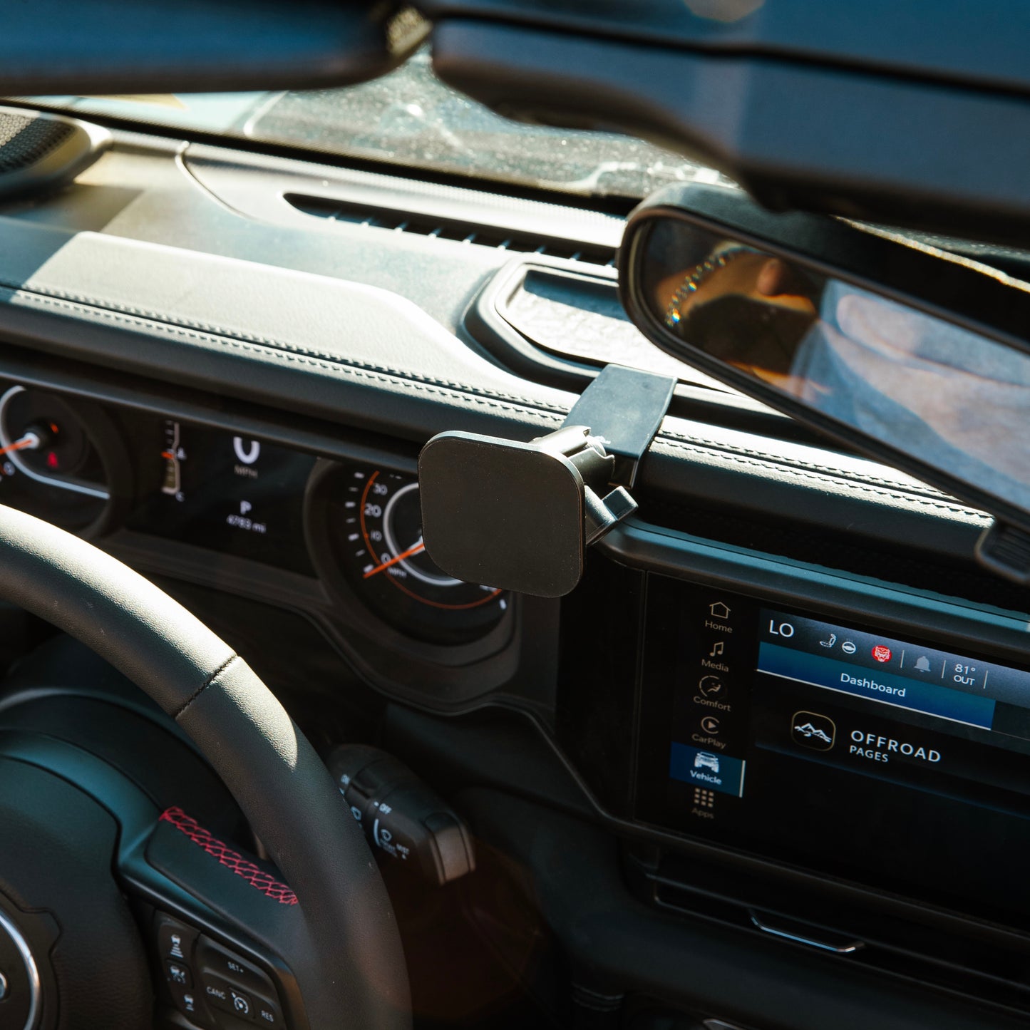 Image of Offroam MagSafe-compatible Phone Mount installed securely in Jeep Wrangler | Gladiator 2024-2025. This premium phone mount installs easily without drilling or glue. High force magnets hold phone on any trail, road, or track. Perfect placement without blocking screens, driver view, or air flow. Fully adjustable positioning.