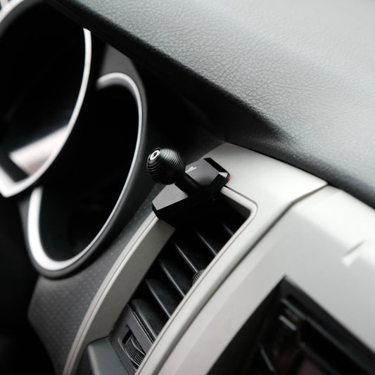 Image of Offroam Mounting Base installed securely in Toyota Tacoma 2005-2011. This premium all metal phone mounting base installs easily without drilling or glue. Perfect placement without blocking screens, driver view, or air flow.