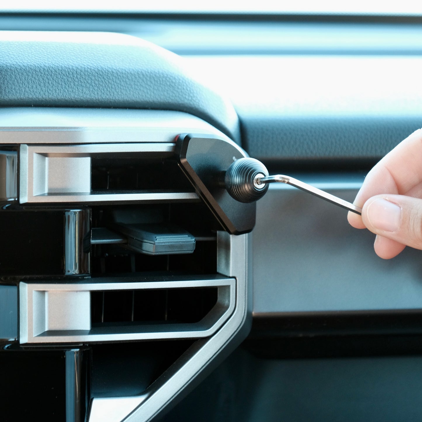 Image of Offroam Mounting Base installed securely in Toyota Tundra 2022-2026 | Sequoia 2023-2026. This premium all metal phone mounting base installs easily without drilling or glue. Perfect placement without blocking screens, driver view, or air flow.