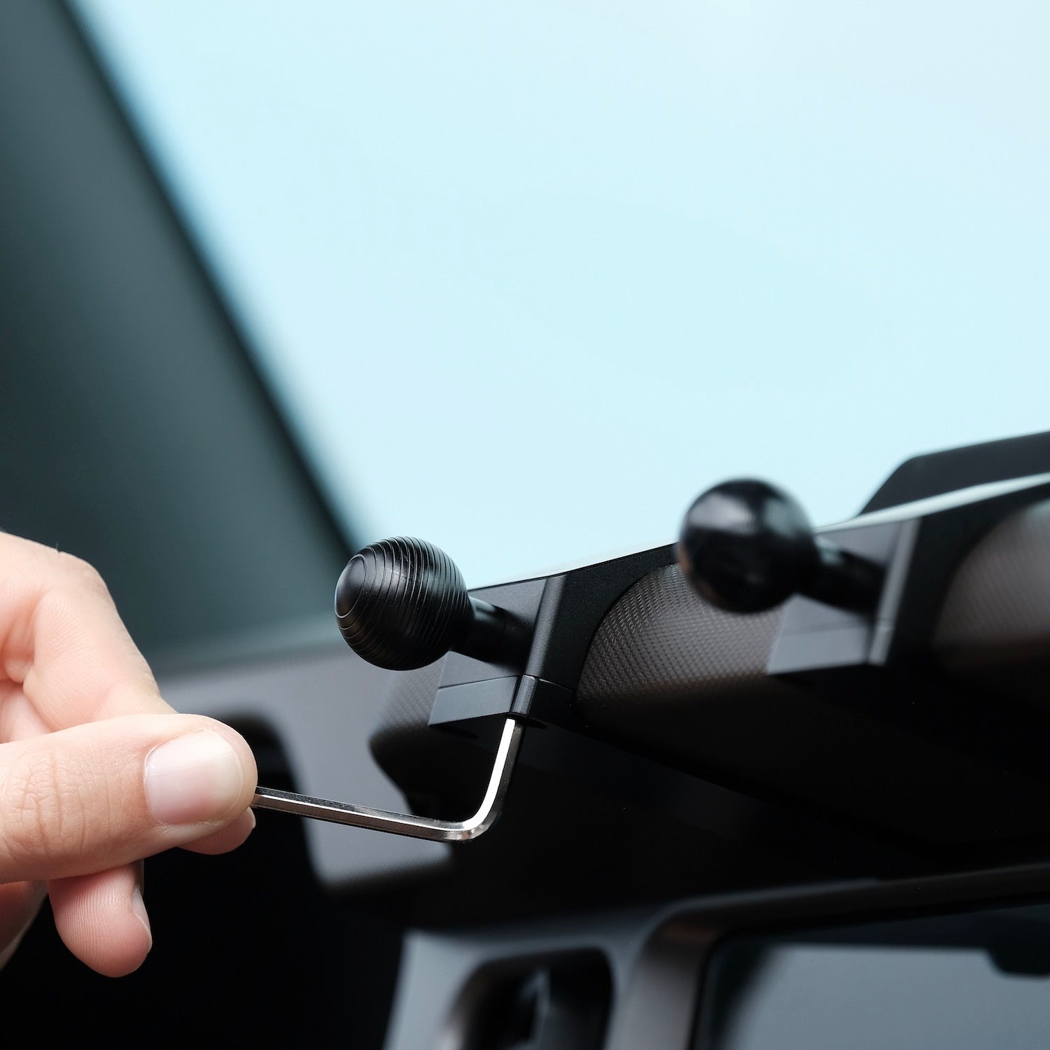 Image of Offroam Mounting Base installed securely in Ford Bronco 2021-2025. This premium all metal phone mounting base installs easily without drilling or glue. Perfect placement without blocking screens, driver view, or air flow.