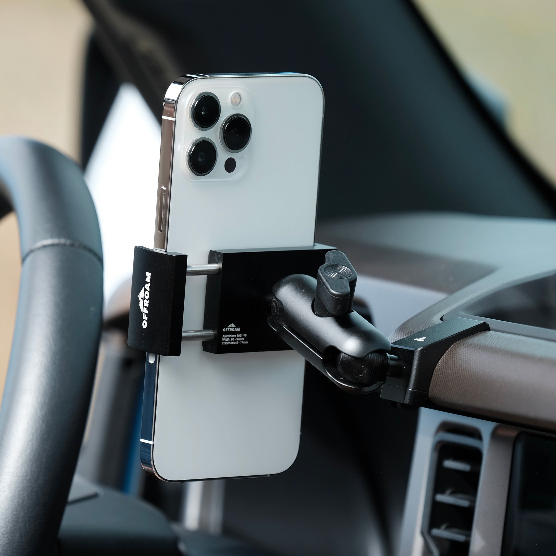 Image of Offroam Phone Mount installed securely in Ford Bronco 2021-2025. This premium phone mount installs easily without drilling or glue. Spring loaded Universal holder for use with any phone. Perfect placement without blocking screens, driver view, or air flow. Fully adjustable positioning.