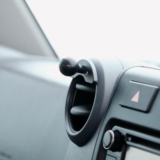 Image of Offroam Mounting Base installed securely in Toyota Land Cruiser 70 2007-2026. This premium all metal phone mounting base installs easily without drilling or glue. Perfect placement without blocking screens, driver view, or air flow.