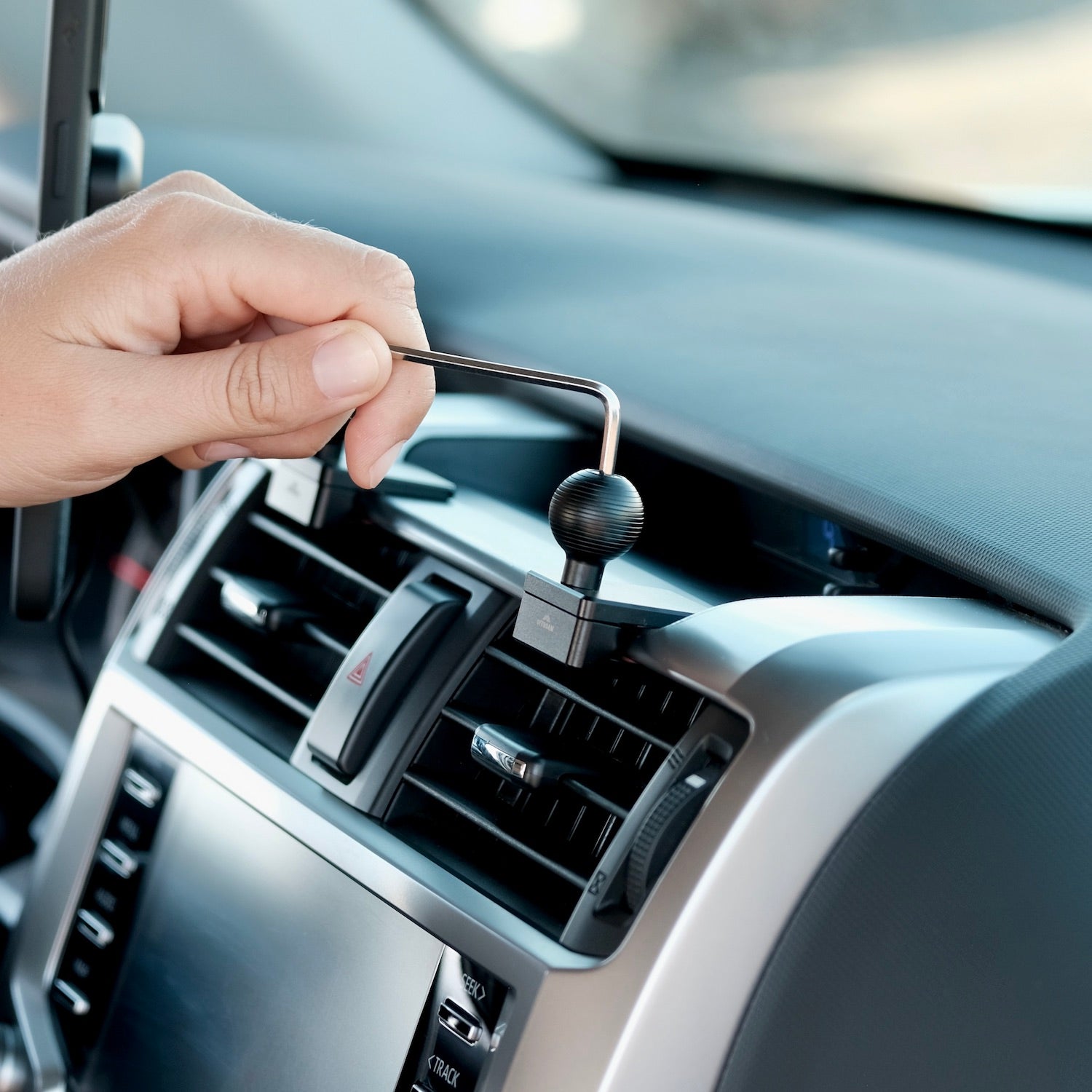 Image of Offroam Mounting Base installed securely in Toyota 4Runner 2010-2024. This premium all metal phone mounting base installs easily without drilling or glue. Perfect placement without blocking screens, driver view, or air flow.