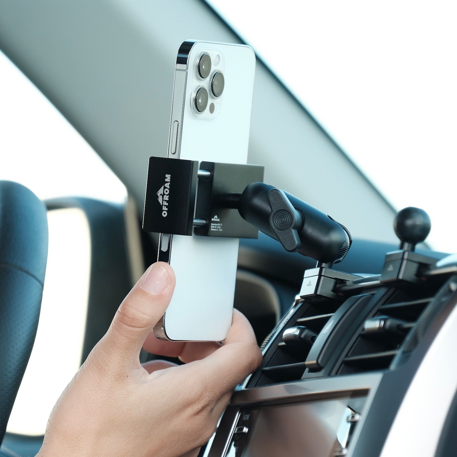 Image of Offroam Phone Mount installed securely in Toyota 4Runner 2010-2024. This premium phone mount installs easily without drilling or glue. Spring loaded Universal holder for use with any phone. Perfect placement without blocking screens, driver view, or air flow. Fully adjustable positioning.