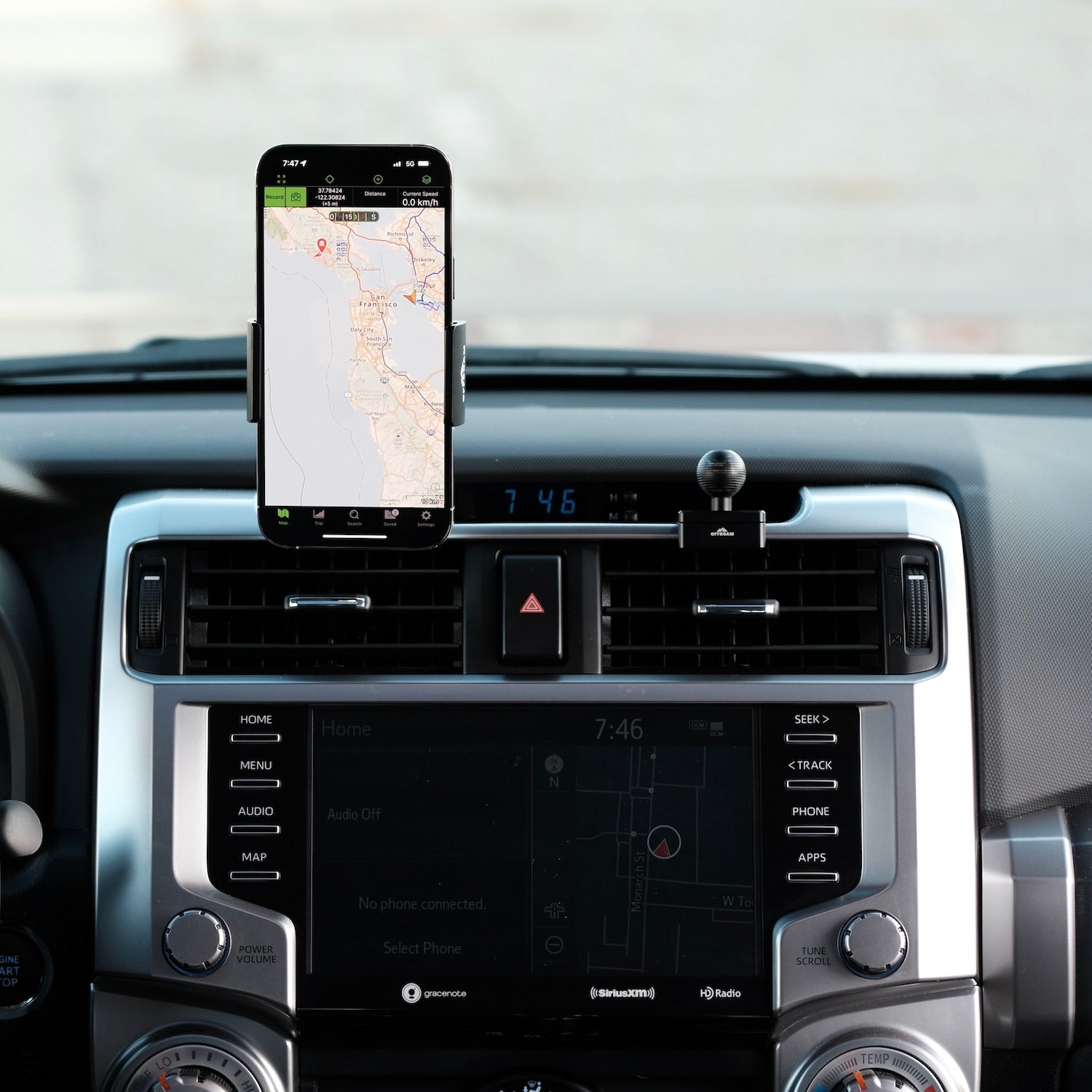 Image of Offroam Phone Mount installed securely in Toyota 4Runner 2010-2024. This premium phone mount installs easily without drilling or glue. Spring loaded Universal holder for use with any phone. Perfect placement without blocking screens, driver view, or air flow. Fully adjustable positioning.