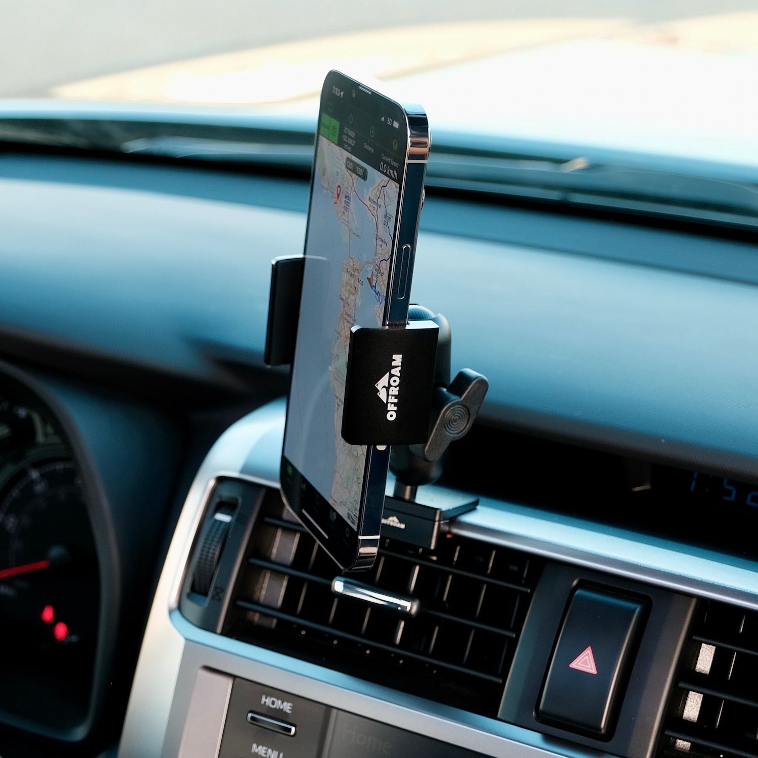 Image of Offroam Phone Mount installed securely in Toyota 4Runner 2010-2024. This premium phone mount installs easily without drilling or glue. Spring loaded Universal holder for use with any phone. Perfect placement without blocking screens, driver view, or air flow. Fully adjustable positioning.