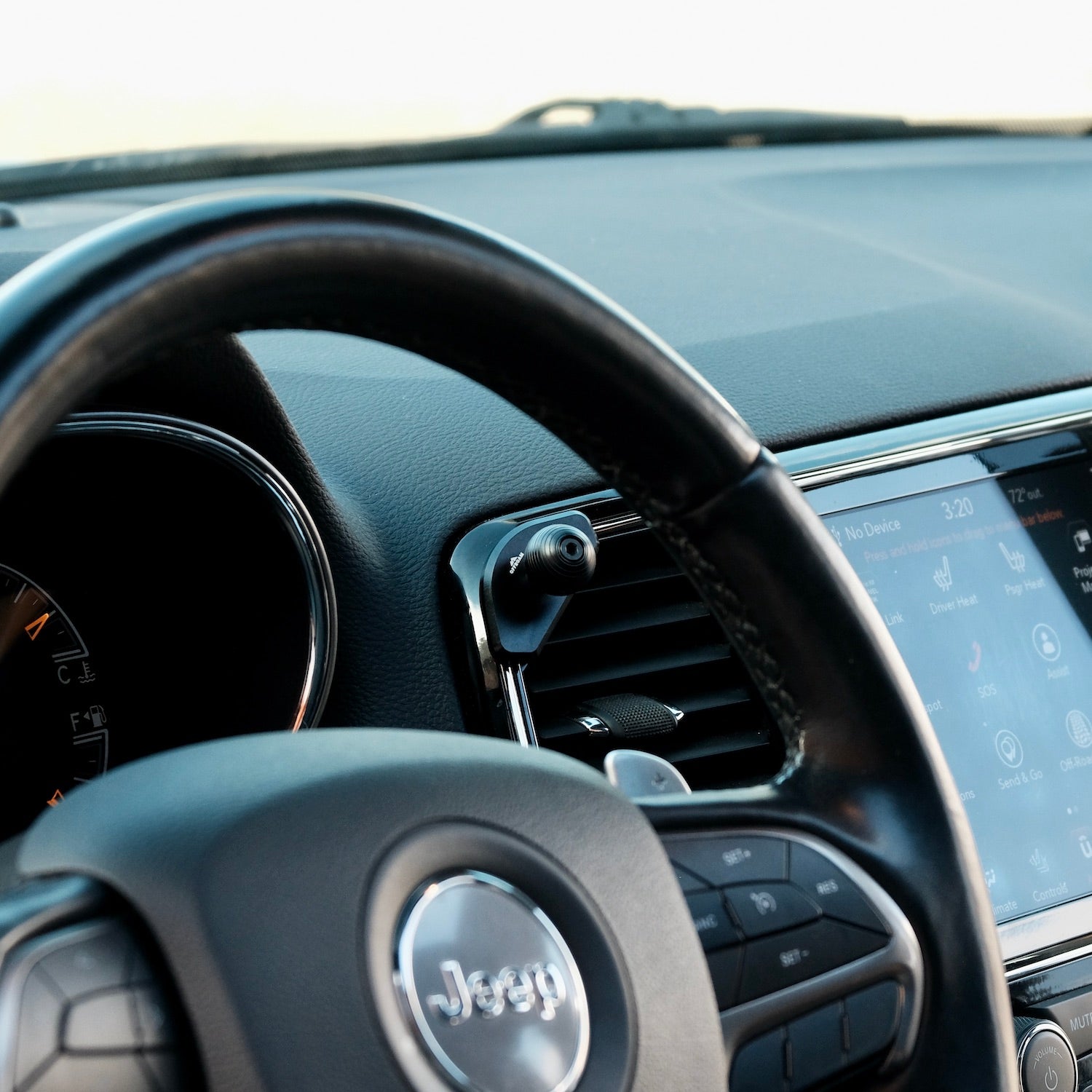 Image of Offroam Mounting Base installed securely in Jeep Grand Cherokee WK2 2014-2022. This premium all metal phone mounting base installs easily without drilling or glue. Perfect placement without blocking screens, driver view, or air flow.