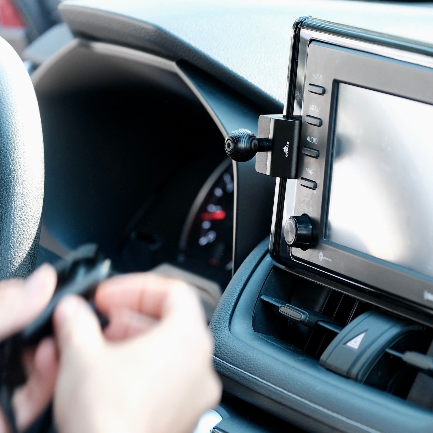 Image of Offroam Mounting Base installed securely in Toyota RAV4 2019-2025 with 7-in. or 8-in. Toyota Audio Multimedia. This premium all metal phone mounting base installs easily without drilling or glue. Perfect placement without blocking screens, driver view, or air flow.