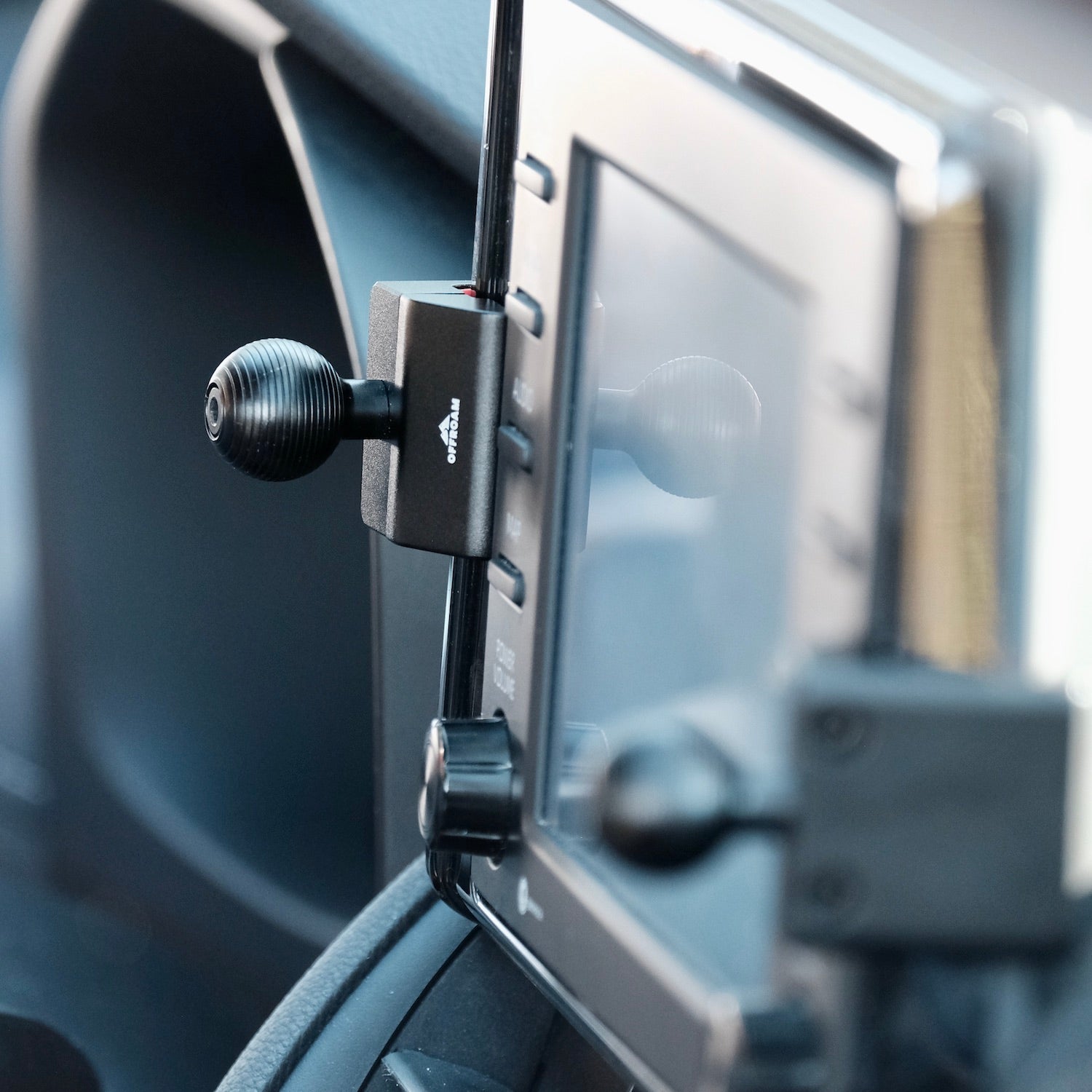 Image of Offroam Mounting Base installed securely in Toyota RAV4 2019-2025 with 7-in. or 8-in. Toyota Audio Multimedia. This premium all metal phone mounting base installs easily without drilling or glue. Perfect placement without blocking screens, driver view, or air flow.