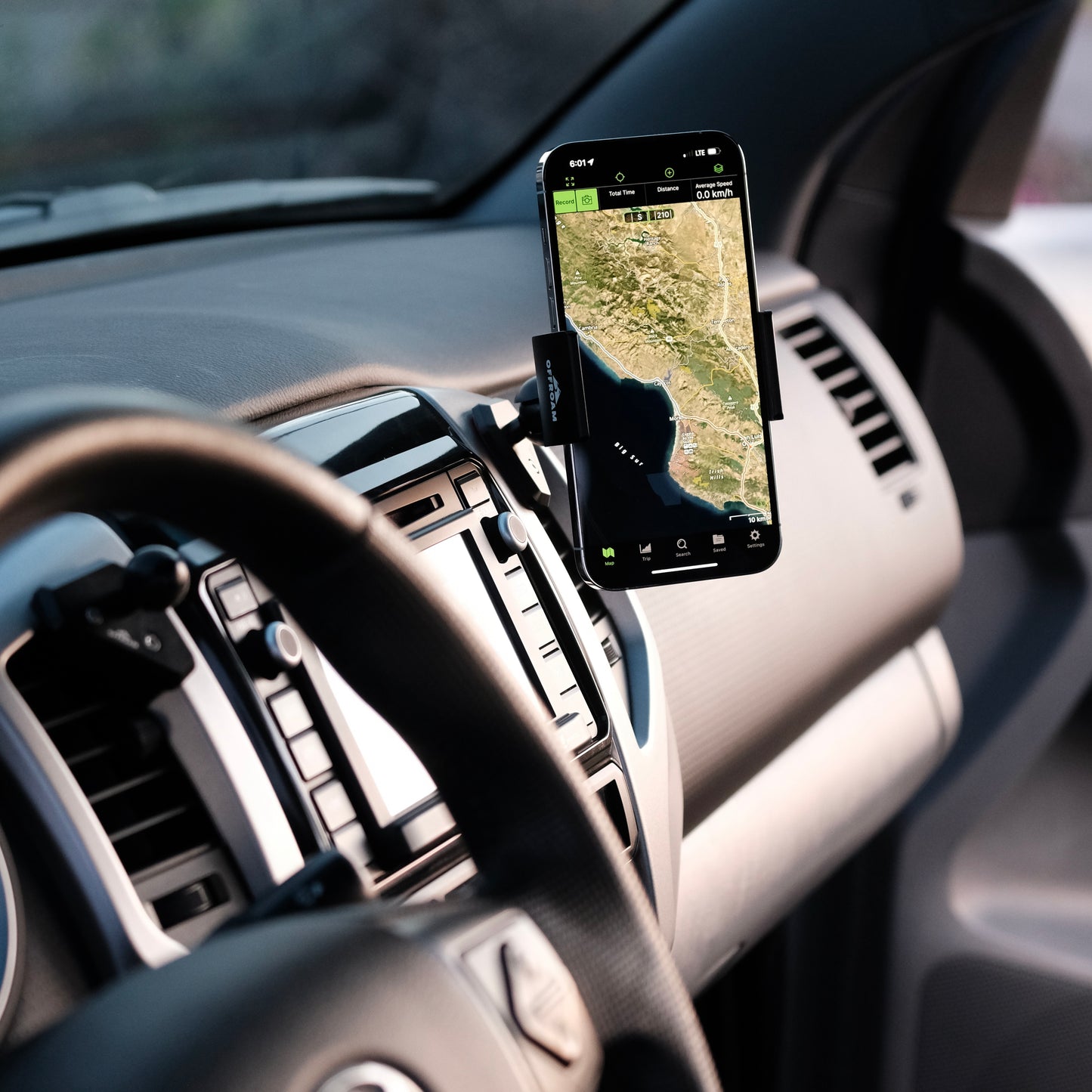 Image of Offroam Phone Mount installed securely in Toyota Tacoma 2012-2015. This premium phone mount installs easily without drilling or glue. Spring loaded Universal holder for use with any phone. Perfect placement without blocking screens, driver view, or air flow. Fully adjustable positioning.