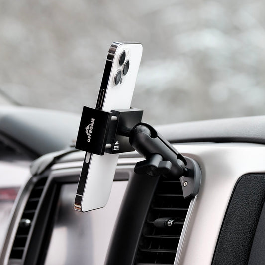 Image of Offroam Phone Mount installed securely in Ram 1500/2500/3500 2013-2018 & Ram Classic 2019-2024. This premium phone mount installs easily without drilling or glue. Spring loaded Universal holder for use with any phone. Perfect placement without blocking screens, driver view, or air flow. Fully adjustable positioning.