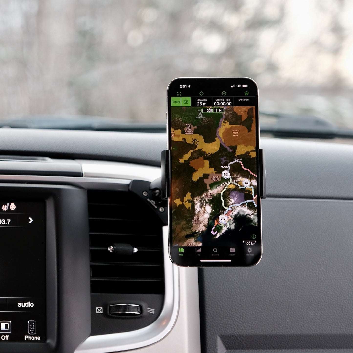 Image of Offroam Phone Mount installed securely in Ram 1500/2500/3500 2013-2018 & Ram Classic 2019-2024. This premium phone mount installs easily without drilling or glue. Spring loaded Universal holder for use with any phone. Perfect placement without blocking screens, driver view, or air flow. Fully adjustable positioning.