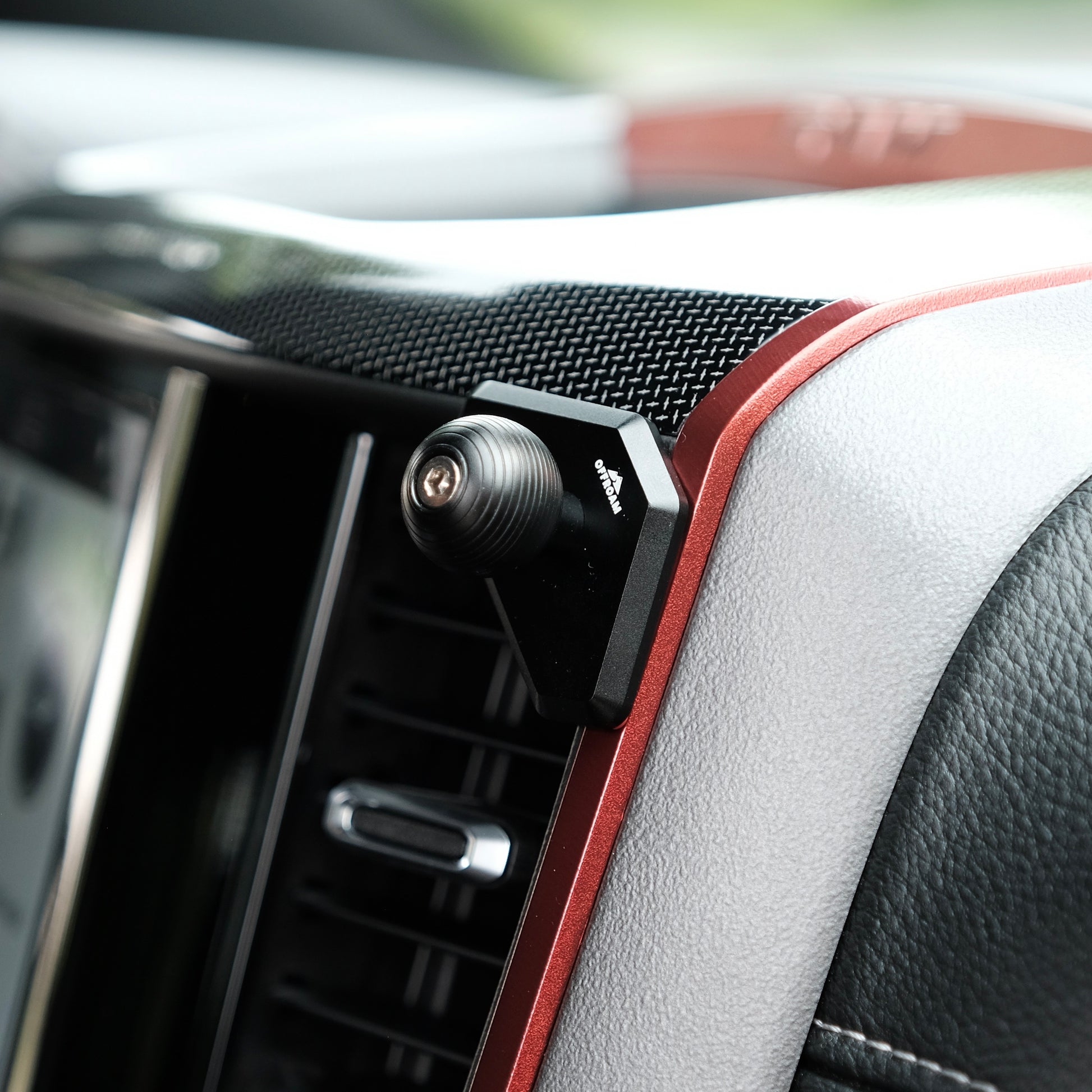 Image of Offroam Mounting Base installed securely in Ram 1500/2500/3500 2019-2025. This premium all metal phone mounting base installs easily without drilling or glue. Perfect placement without blocking screens, driver view, or air flow.