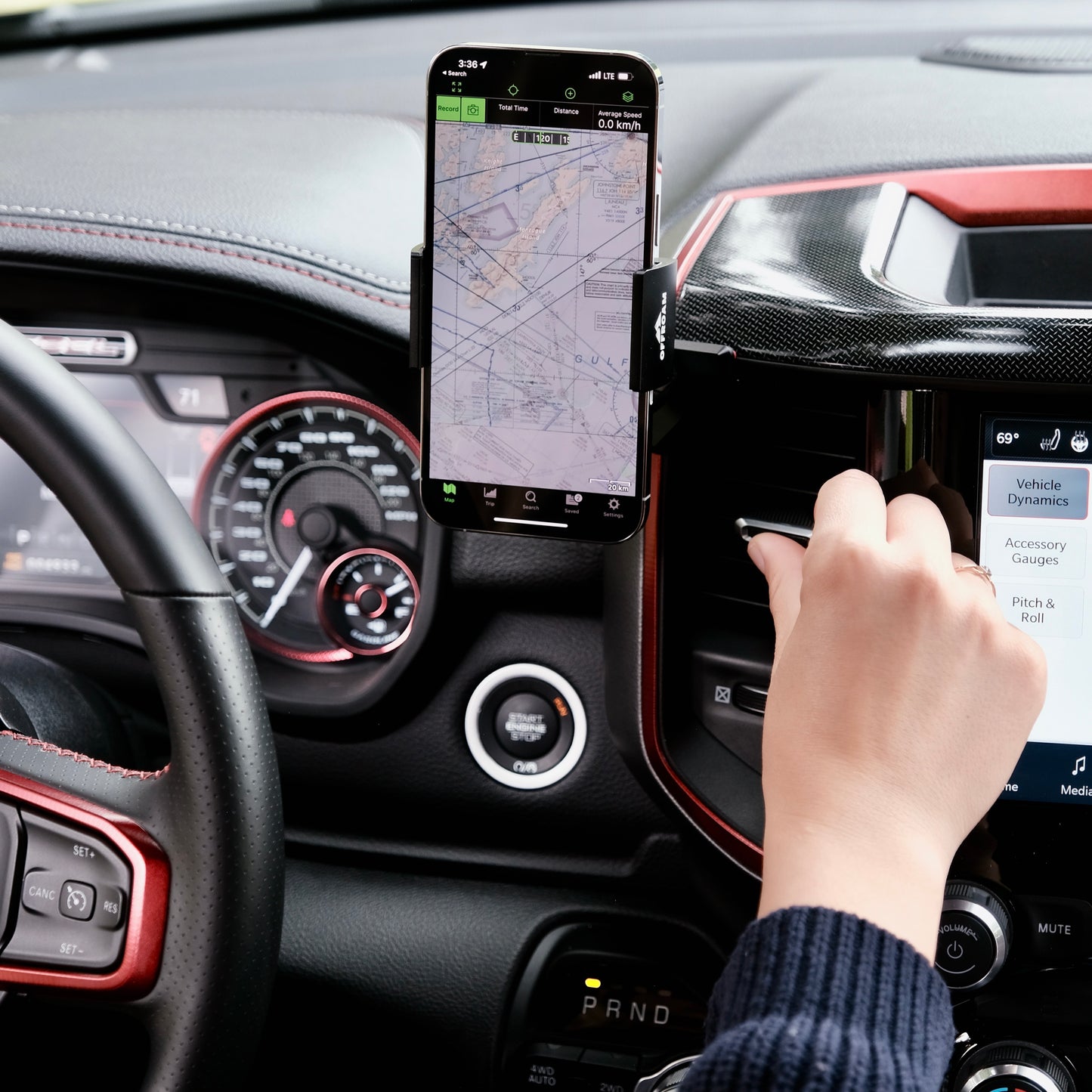 Image of Offroam Phone Mount installed securely in Ram 1500/2500/3500 2019-2025. This premium phone mount installs easily without drilling or glue. Spring loaded Universal holder for use with any phone. Perfect placement without blocking screens, driver view, or air flow. Fully adjustable positioning.