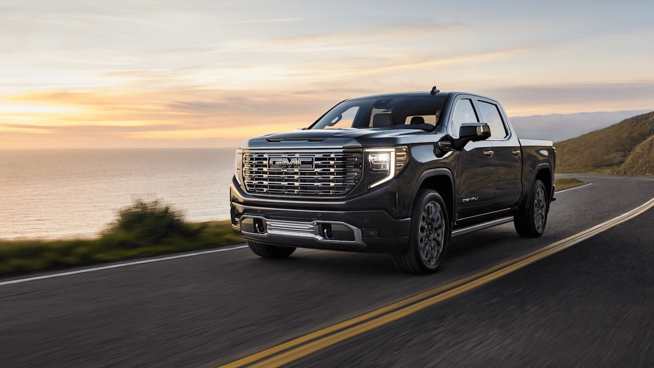 Image of GMC Sierra 2022-2025 on a coastal road.
