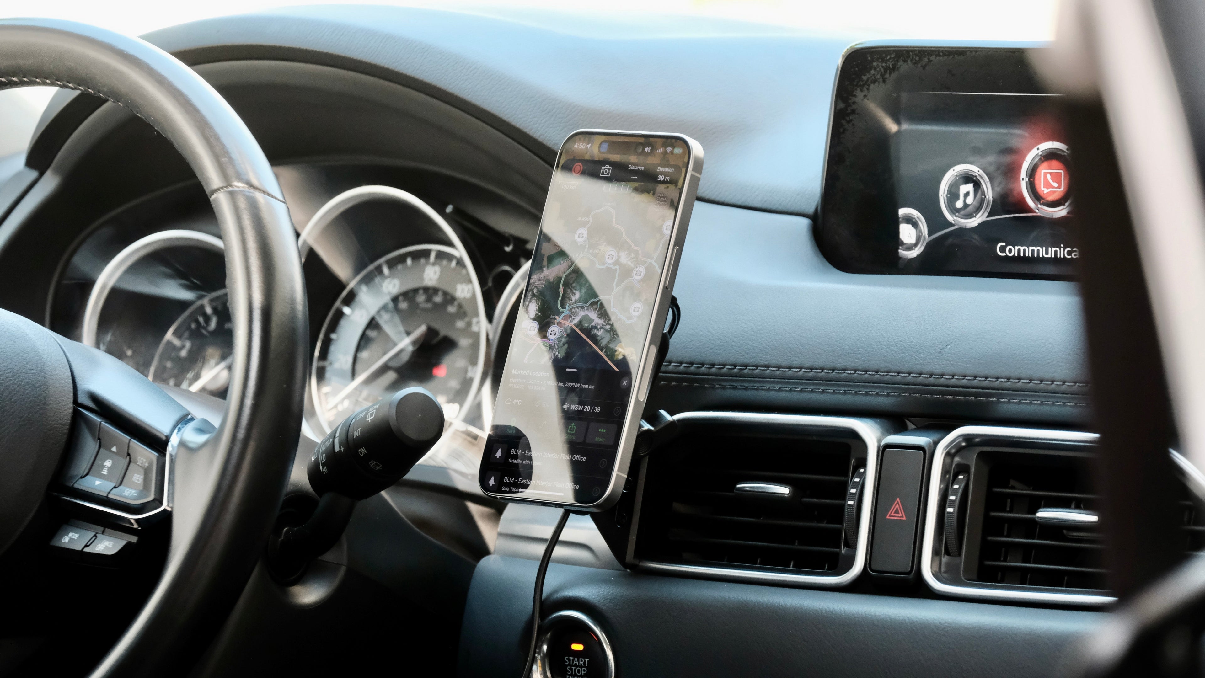 Offroam phone mount installed in 2017-2025 Mazda CX-5. Shown with phone held by MagSafe-compatible Qi2 wireless charging holder