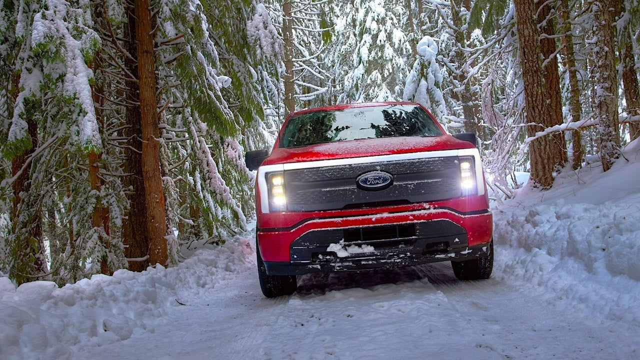 Image of Ford F-150 Lightning 2022-2024 on a snowy trail.