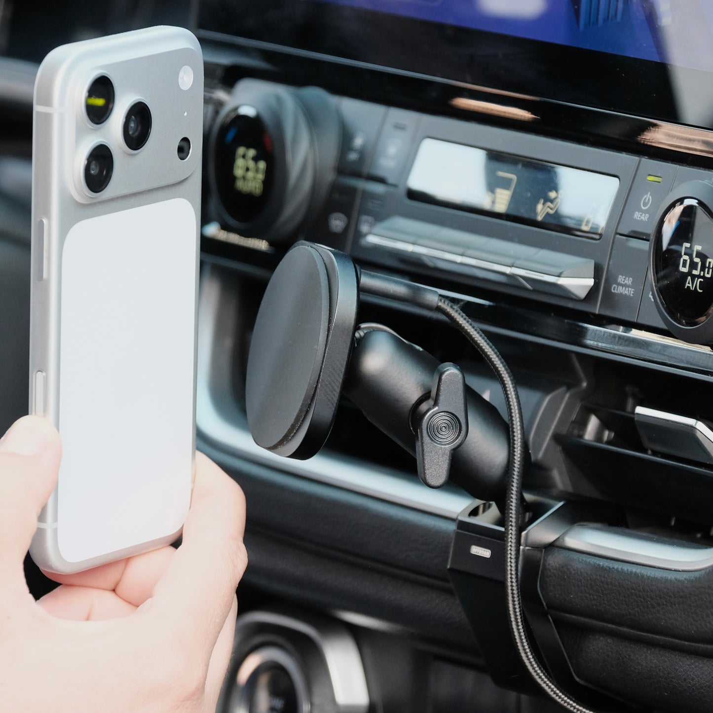 Image of Offroam MagSafe-compatible Phone Mount installed securely in Toyota Grand Highlander 2024-2026. This premium phone mount installs easily without drilling or glue. High force magnets hold phone on any trail, road, or track. Perfect placement without blocking screens, driver view, or air flow. Fully adjustable positioning.