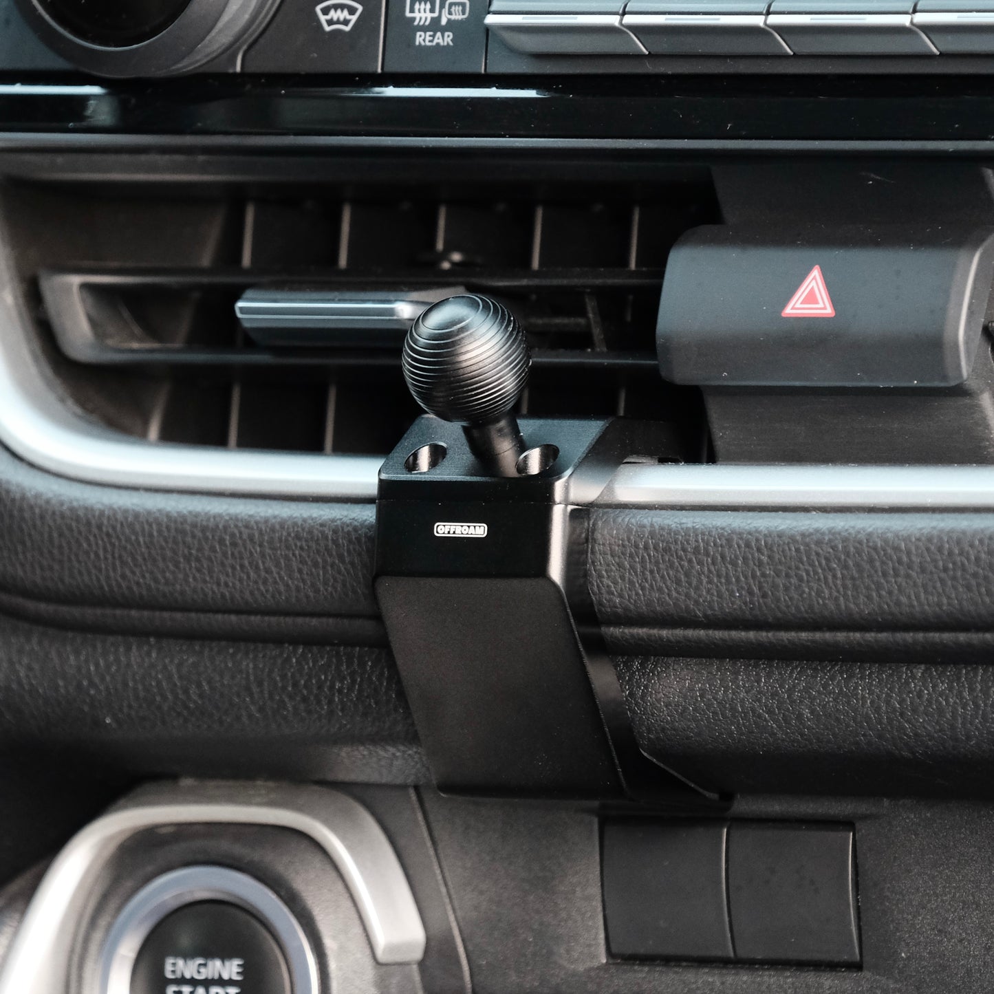 Image of Offroam Mounting Base installed securely in Toyota Grand Highlander 2024-2026. This premium all metal phone mounting base installs easily without drilling or glue. Perfect placement without blocking screens, driver view, or air flow.