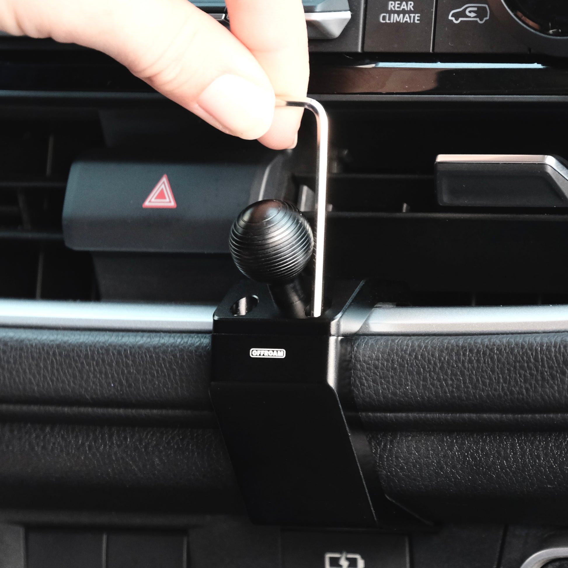 Image of Offroam Mounting Base installation in Toyota Grand Highlander 2024-2026. This premium all metal phone mounting base installs easily without drilling or glue. Perfect placement without blocking screens, driver view, or air flow.