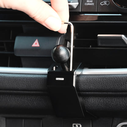 Image of Offroam Mounting Base installation in Toyota Grand Highlander 2024-2026. This premium all metal phone mounting base installs easily without drilling or glue. Perfect placement without blocking screens, driver view, or air flow.