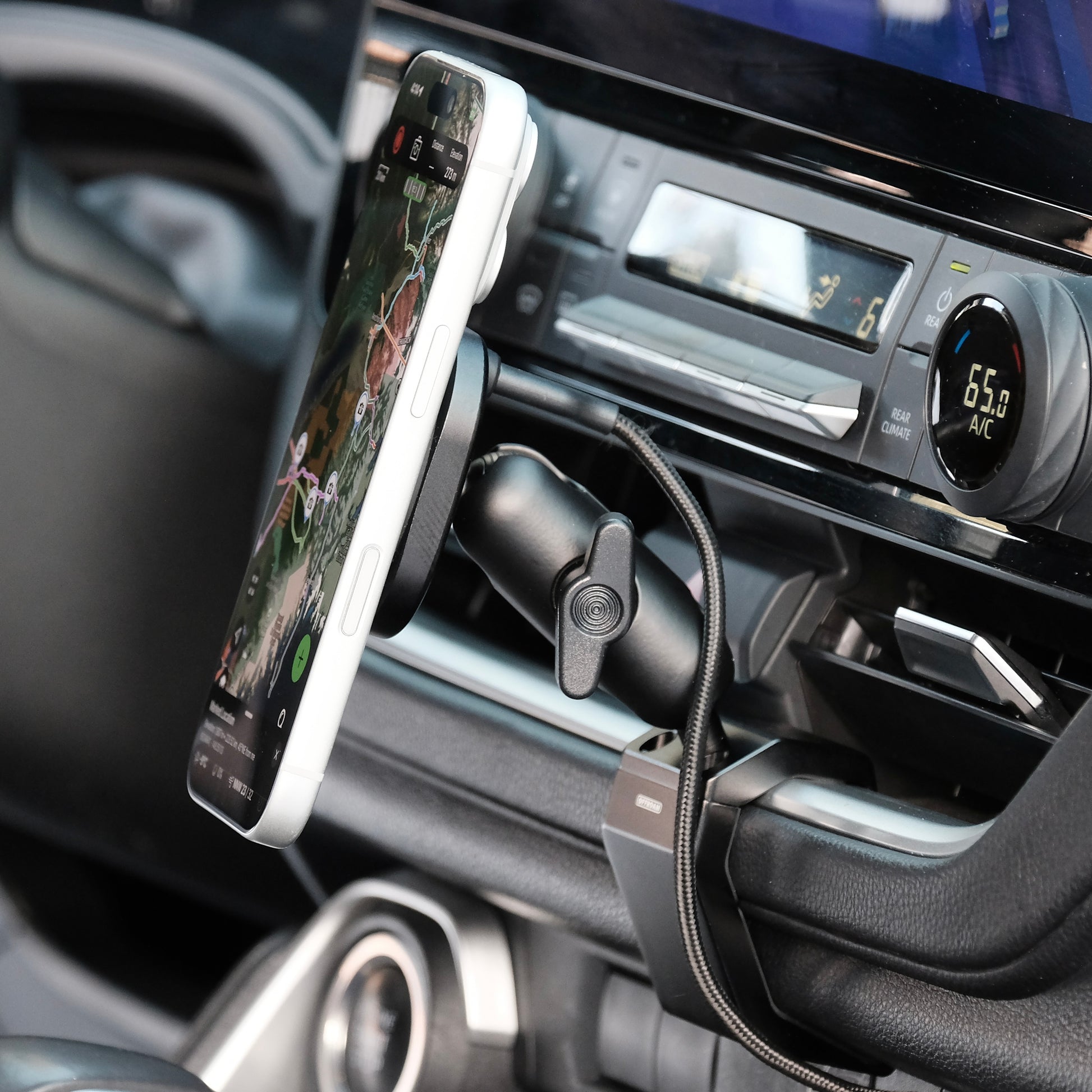 Image of Offroam MagSafe-compatible Phone Mount installed securely in Toyota Grand Highlander 2024-2026. This premium phone mount installs easily without drilling or glue. High force magnets hold phone on any trail, road, or track. Perfect placement without blocking screens, driver view, or air flow. Fully adjustable positioning.