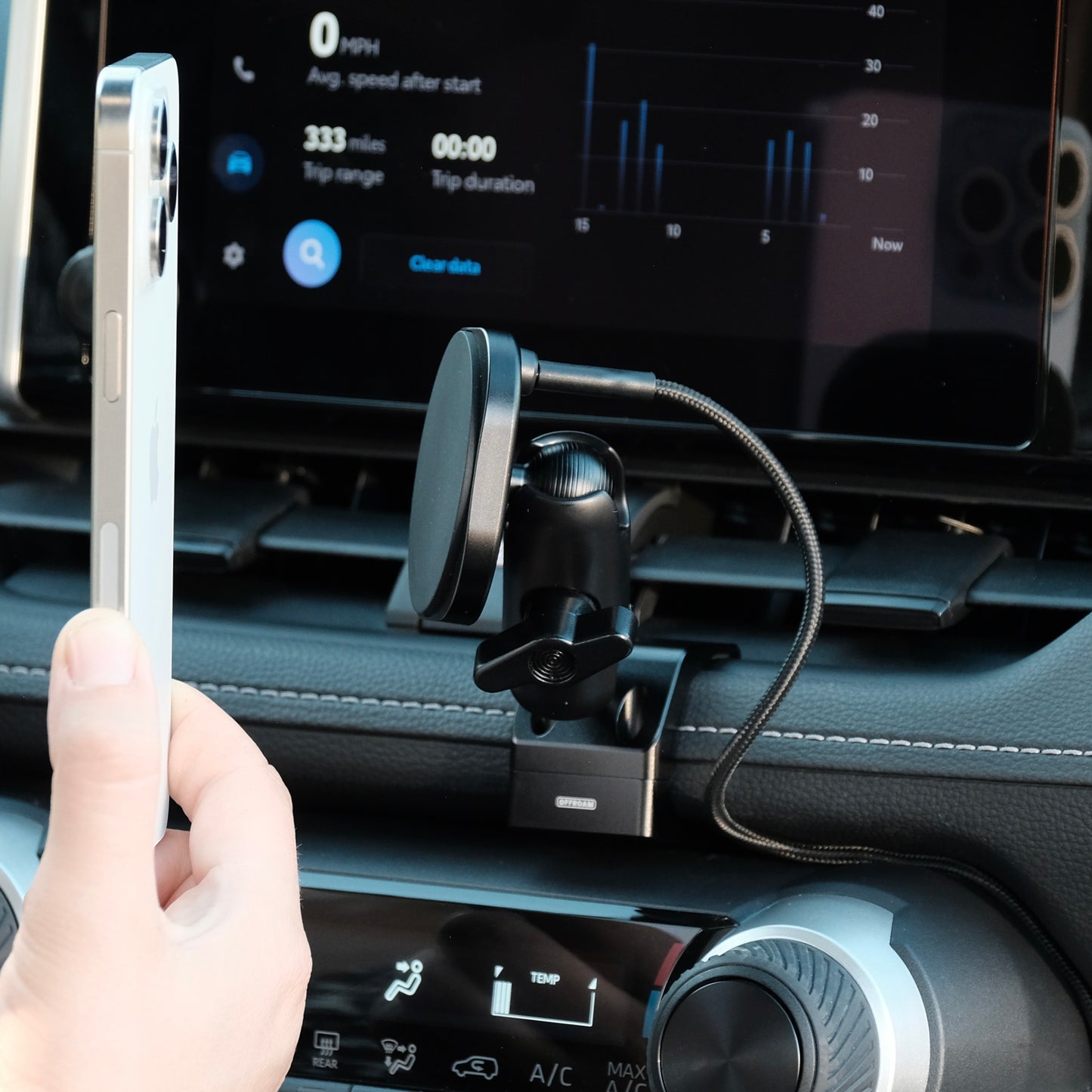 Image of Offroam MagSafe-compatible Phone Mount installed securely in Toyota RAV4 2019-2025. This premium phone mount installs easily without drilling or glue. High force magnets hold phone on any trail, road, or track. Perfect placement without blocking screens, driver view, or air flow. Fully adjustable positioning.