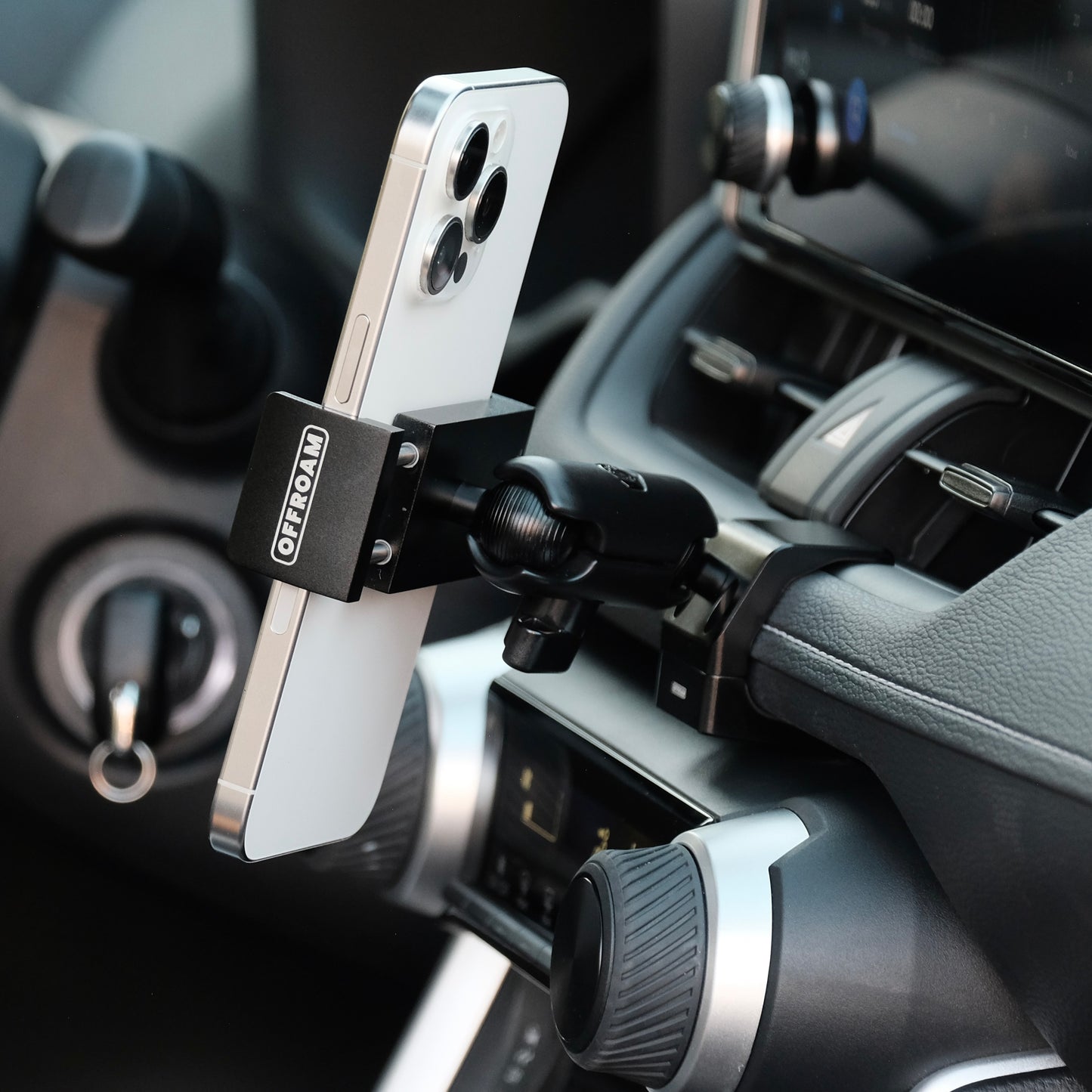 Image of Offroam Phone Mount installed securely in Toyota RAV4 2019-2025. This premium phone mount installs easily without drilling or glue. Spring loaded Universal holder for use with any phone. Perfect placement without blocking screens, driver view, or air flow. Fully adjustable positioning.