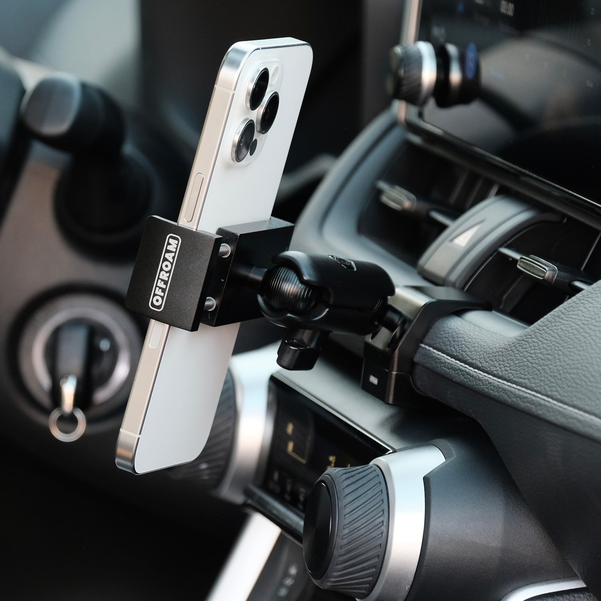 Image of Offroam Phone Mount installed securely in Toyota RAV4 2019-2025. This premium phone mount installs easily without drilling or glue. Spring loaded Universal holder for use with any phone. Perfect placement without blocking screens, driver view, or air flow. Fully adjustable positioning.