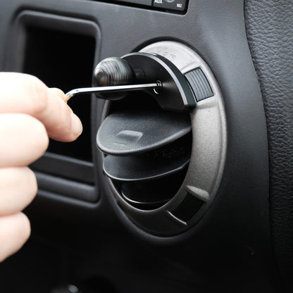 Offroam mounting base with 20mm ball shown being installed in Jeep Wrangler JK 2011-2018 air vent bezel without blocking air flow.
