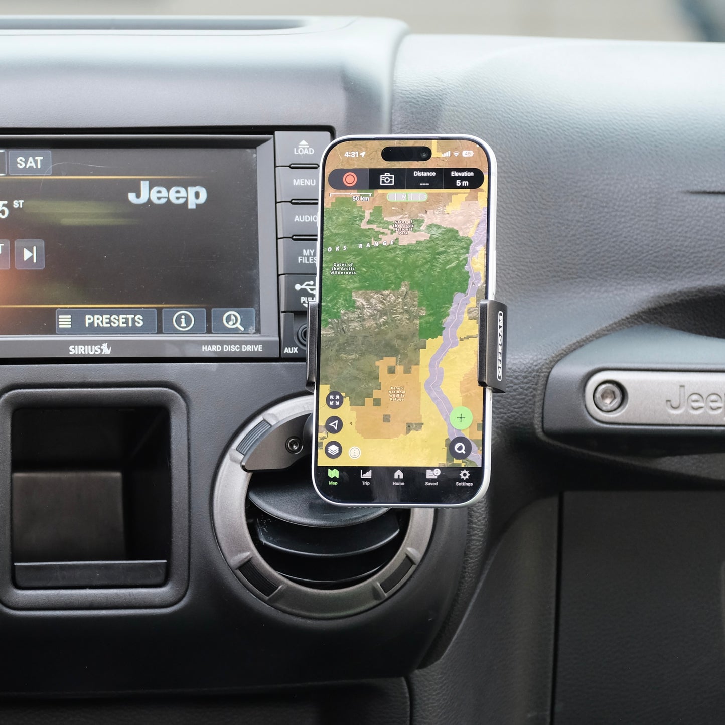 Offroam phone mount with 20mm ball shown installed in Jeep Wrangler JK 2011-2018 air vent bezel without blocking air flow holding the phone securely on off-road trails.