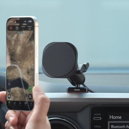 Image of Offroam MagSafe-compatible Phone Mount installed securely in Toyota Tacoma 2016-2023. This premium phone mount installs easily without drilling or glue. High force magnets hold phone on any trail, road, or track. Perfect placement without blocking screens, driver view, or air flow. Fully adjustable positioning.