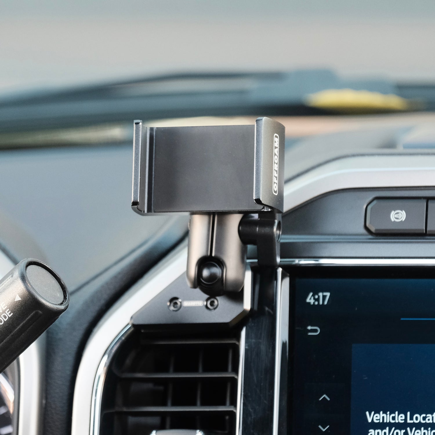 Image of Offroam Phone Mount installed securely in Ford Super Duty 2022 (12in. SYNC4 Touchscreen). This premium phone mount installs easily without drilling or glue. Spring loaded Universal holder for use with any phone. Perfect placement without blocking screens, driver view, or air flow. Fully adjustable positioning.