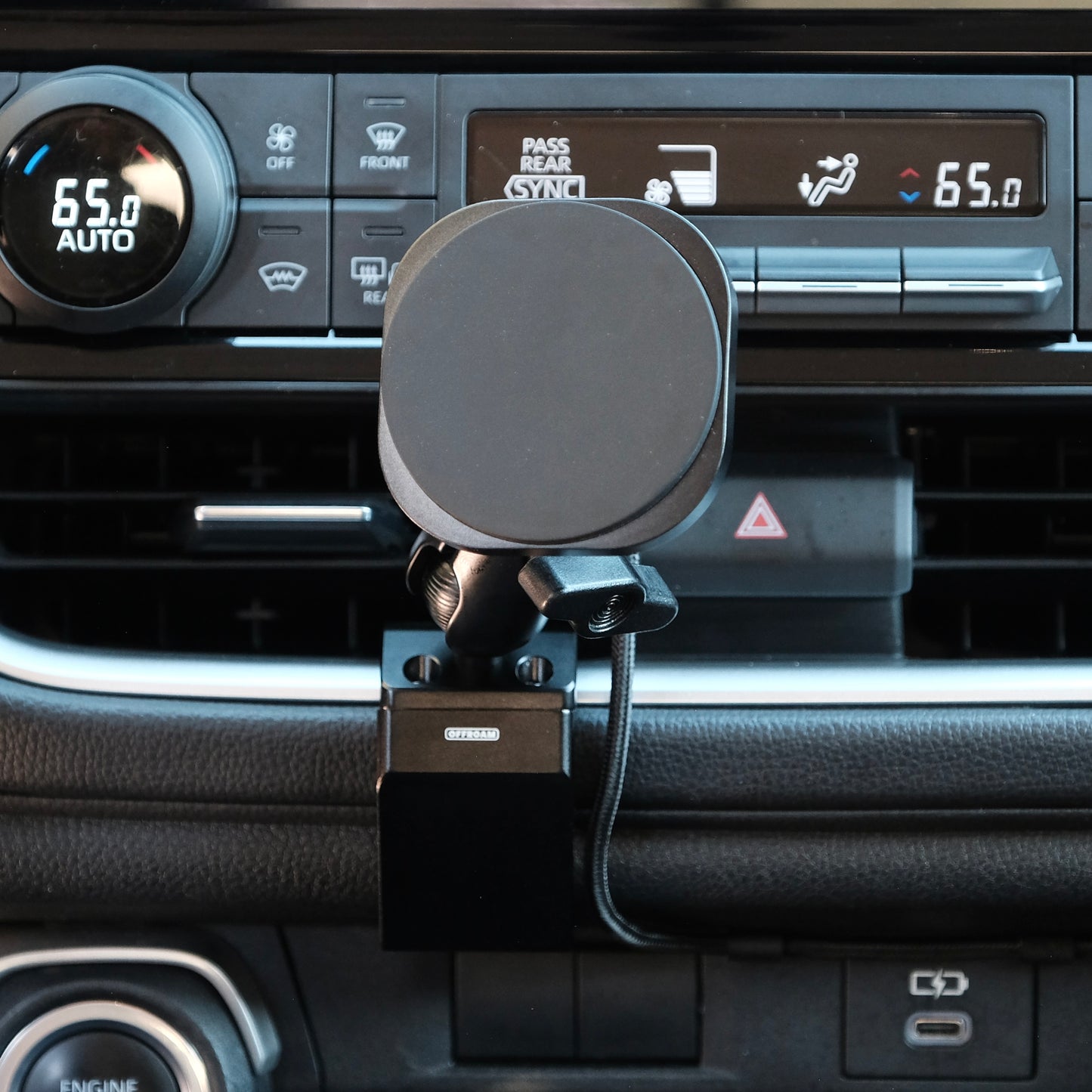 Image of Offroam MagSafe-compatible Phone Mount installed securely in Toyota Grand Highlander 2024-2026. This premium phone mount installs easily without drilling or glue. High force magnets hold phone on any trail, road, or track. Perfect placement without blocking screens, driver view, or air flow. Fully adjustable positioning.
