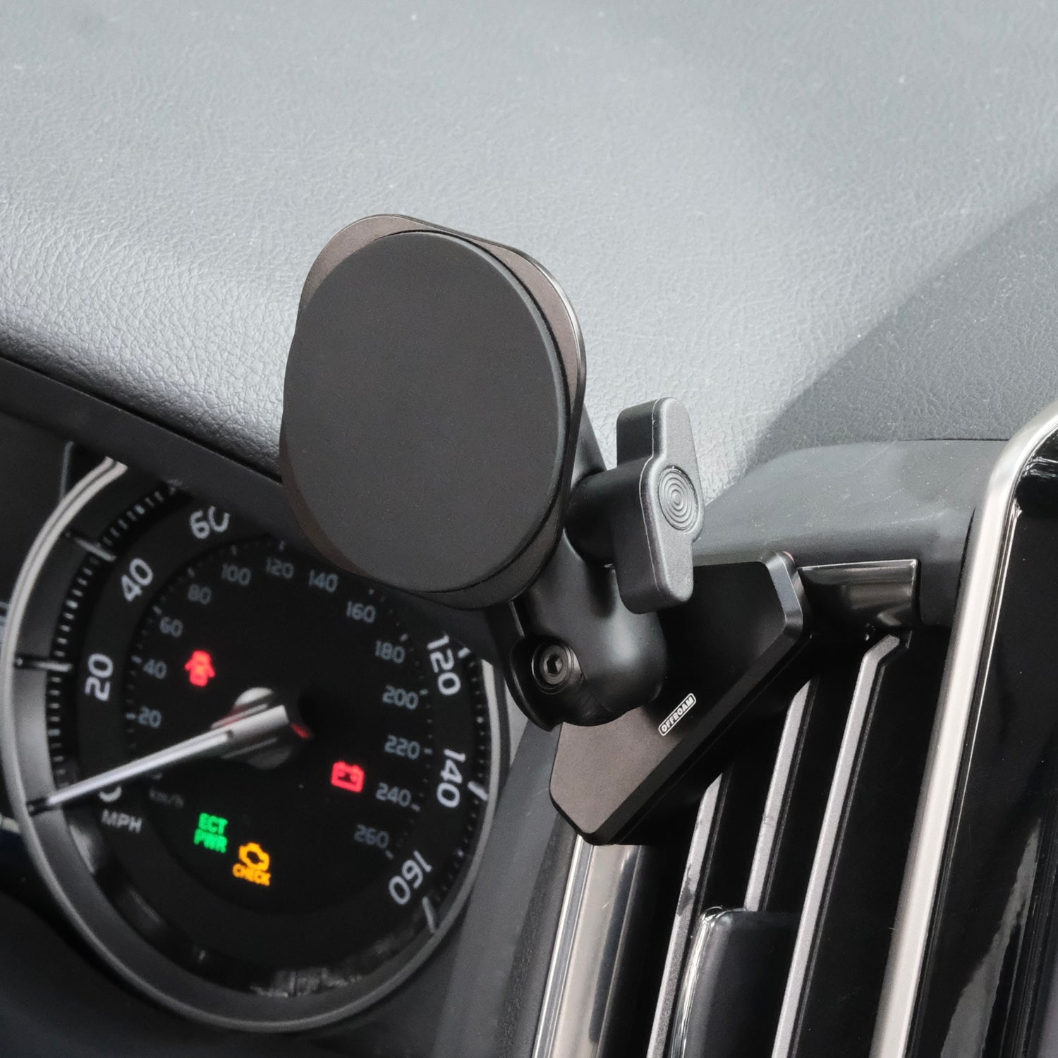 Image of Offroam MagSafe-compatible Phone Mount installed securely in Toyota Land Cruiser 200 2016-2021. This premium phone mount installs easily without drilling or glue. High force magnets hold phone on any trail, road, or track. Perfect placement without blocking screens, driver view, or air flow. Fully adjustable positioning.