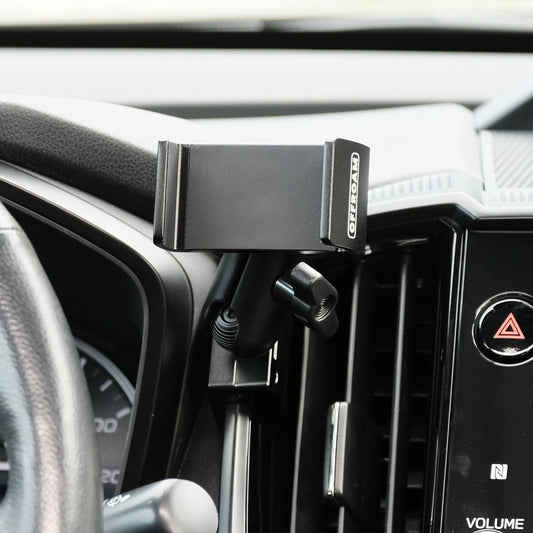 Image of Offroam Phone Mount installed securely in Subaru Ascent 2023-2026. This premium phone mount installs easily without drilling or glue. Spring loaded Universal holder for use with any phone. Perfect placement without blocking screens, driver view, or air flow. Fully adjustable positioning.