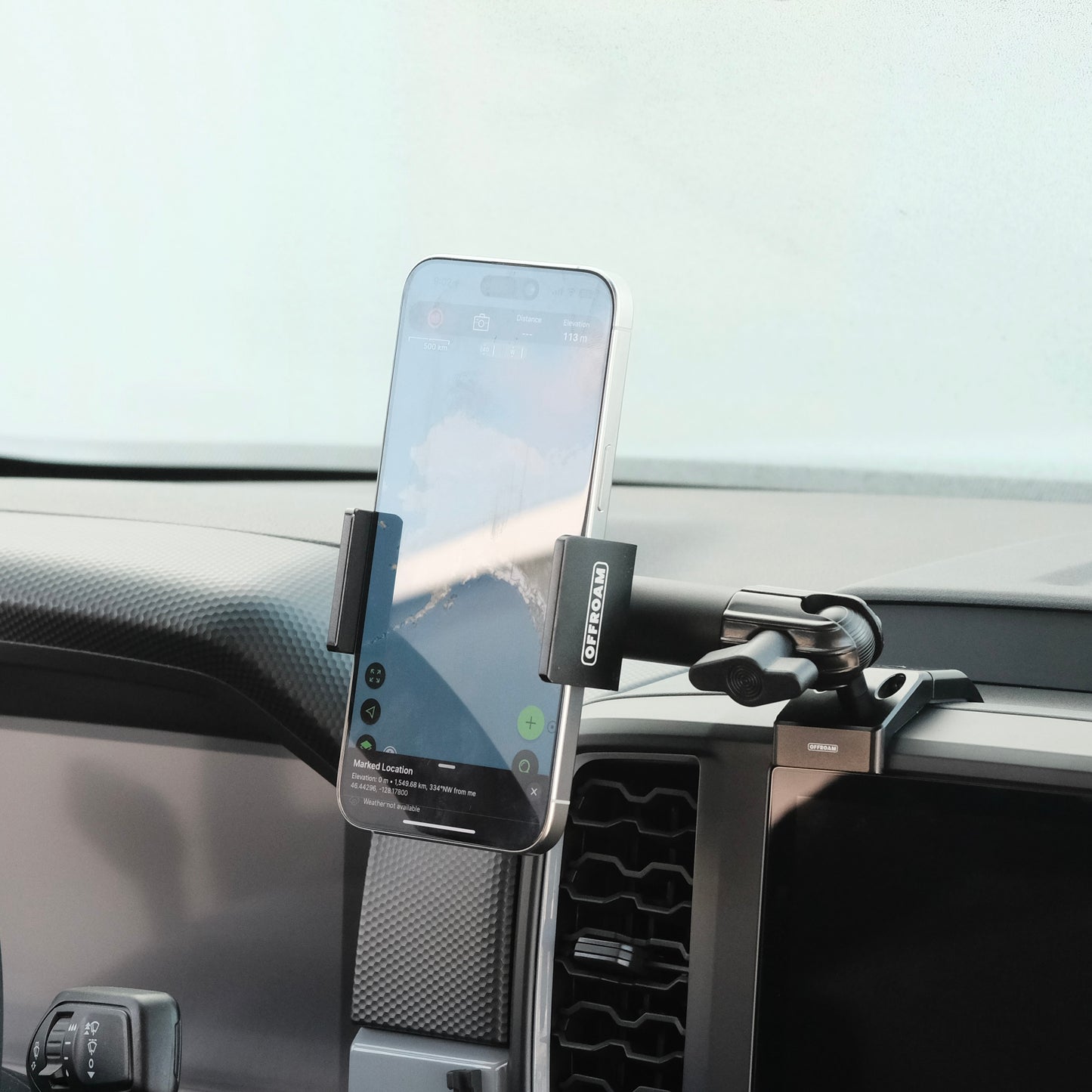 Image of Offroam Phone Mount installed securely in Ford Ranger 2024-2025. This premium phone mount installs easily without drilling or glue. Spring loaded Universal holder for use with any phone. Perfect placement without blocking screens, driver view, or air flow. Fully adjustable positioning.
