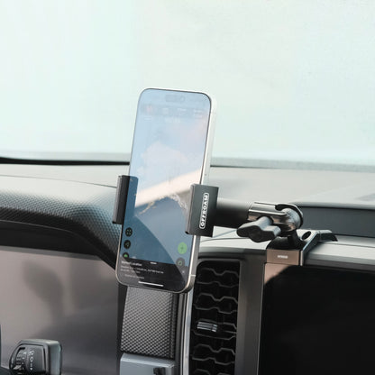 Image of Offroam Phone Mount installed securely in Ford Ranger 2024-2025. This premium phone mount installs easily without drilling or glue. Spring loaded Universal holder for use with any phone. Perfect placement without blocking screens, driver view, or air flow. Fully adjustable positioning.