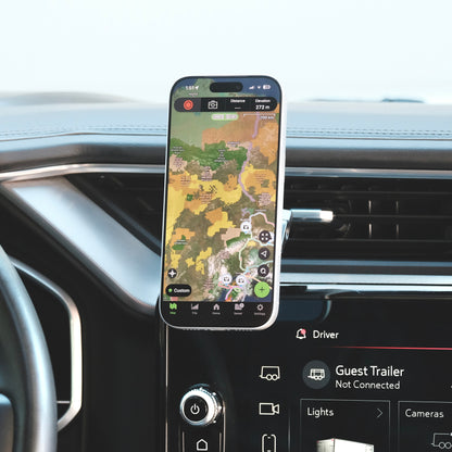 Image of Offroam MagSafe-compatible Phone Mount installed securely in GMC Sierra 1500 2022-2026 | Sierra HD 2024-2026  (AT4, AT4x, Denali, Denali Ultimate). This premium phone mount installs easily without drilling or glue. High force magnets hold phone on any trail, road, or track. Perfect placement without blocking screens, driver view, or air flow. Fully adjustable positioning.