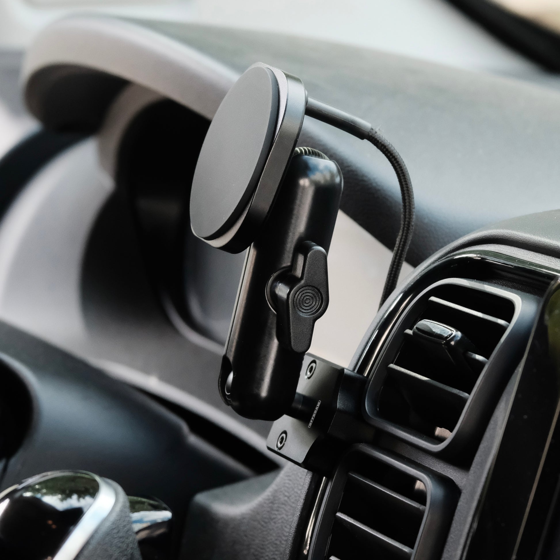 Image of Offroam MagSafe-compatible Phone Mount installed securely in RAM ProMaster 2022-2026. This premium phone mount installs easily without drilling or glue. High force magnets hold phone on any trail, road, or track. Perfect placement without blocking screens, driver view, or air flow. Fully adjustable positioning.