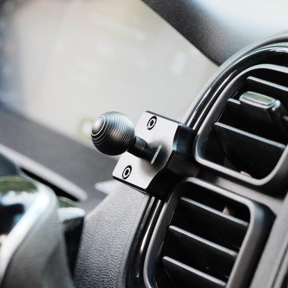 Image of Offroam Mounting Base installed securely in RAM ProMaster 2022-2026. This premium all metal phone mounting base installs easily without drilling or glue. Perfect placement without blocking screens, driver view, or air flow.