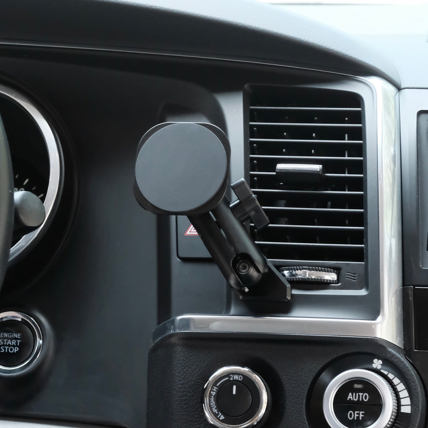 Image of Offroam MagSafe-compatible Phone Mount installed securely in Toyota Tundra 2007-2013 | Sequoia 2008-2022. This premium phone mount installs easily without drilling or glue. High force magnets hold phone on any trail, road, or track. Perfect placement without blocking screens, driver view, or air flow. Fully adjustable positioning.