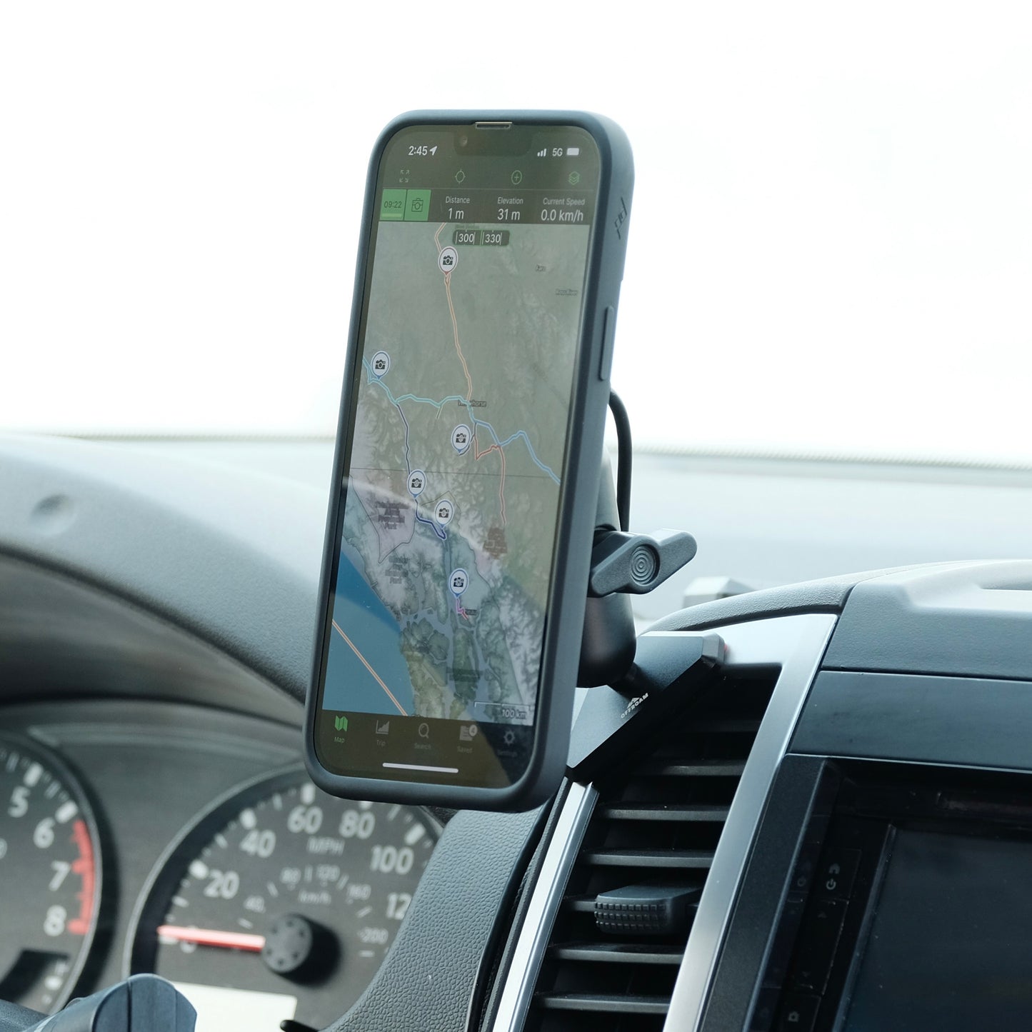 Image of Offroam MagSafe-compatible Qi2 Charging Phone Mount installed securely in Nissan Frontier 2009-2021 | Xterra 2009-2015. This premium phone mount installs easily without drilling or glue. High force magnets hold phone on any trail, road, or track. Qi2 fast wireless charging. Perfect placement without blocking screens, driver view, or air flow. Fully adjustable positioning.