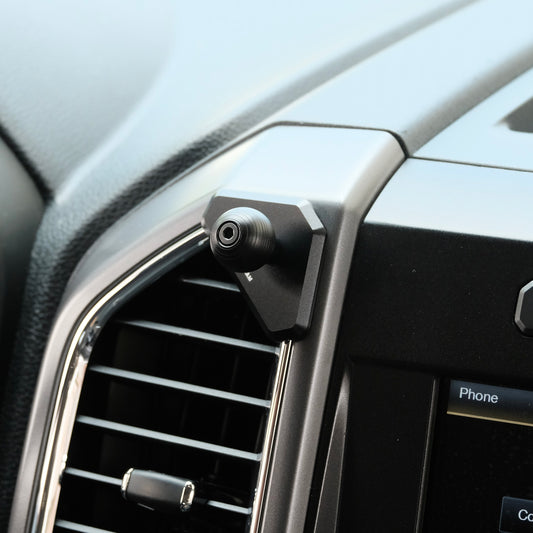 Image of Offroam Mounting Base installed securely in Ford F-150 2015-2020 | Super Duty 2017-2021 & 2022 (XL and XLT) | Expedition 2018-2021. This premium all metal phone mounting base installs easily without drilling or glue. Perfect placement without blocking screens, driver view, or air flow.
