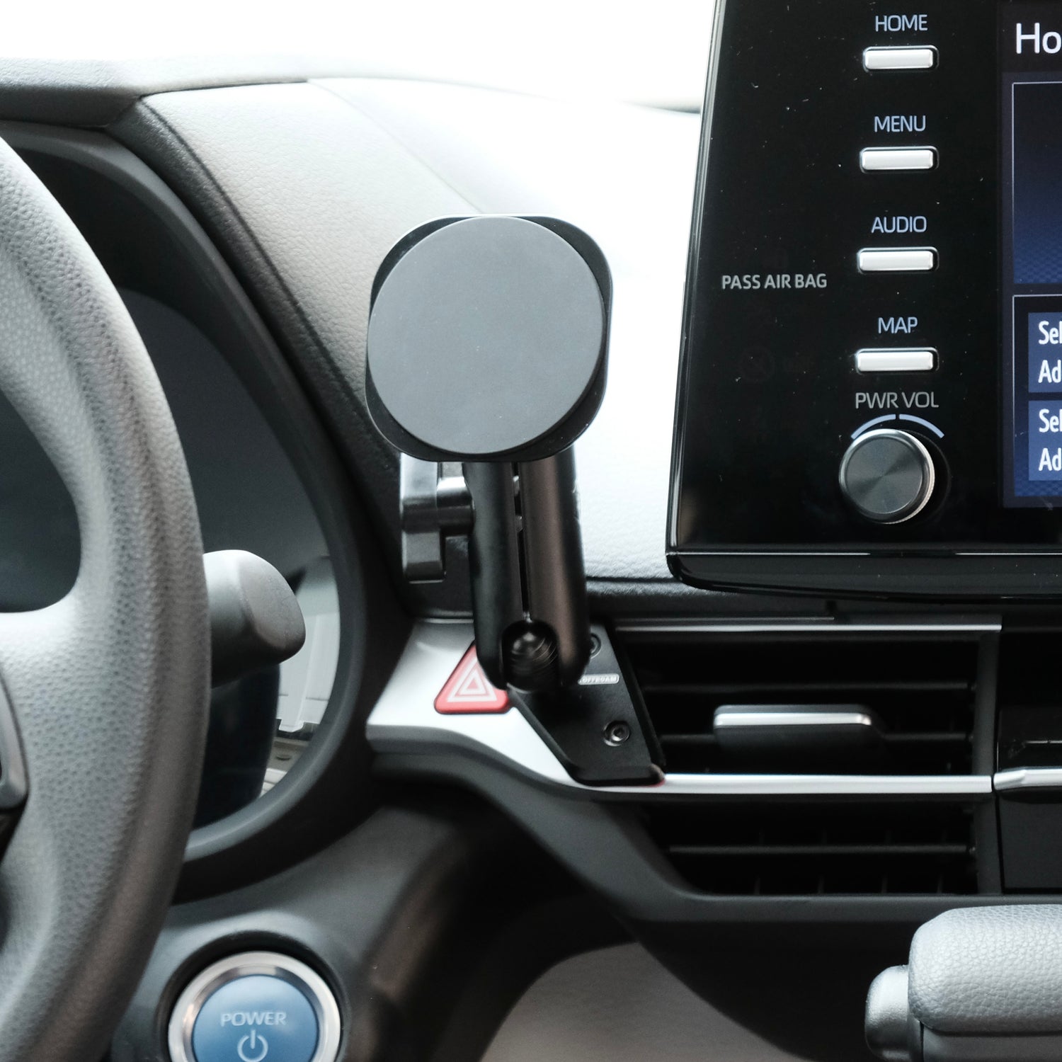 Image of Offroam MagSafe-compatible Phone Mount installed securely in Toyota Sienna 2021-2026. This premium phone mount installs easily without drilling or glue. High force magnets hold phone on any trail, road, or track. Perfect placement without blocking screens, driver view, or air flow. Fully adjustable positioning.