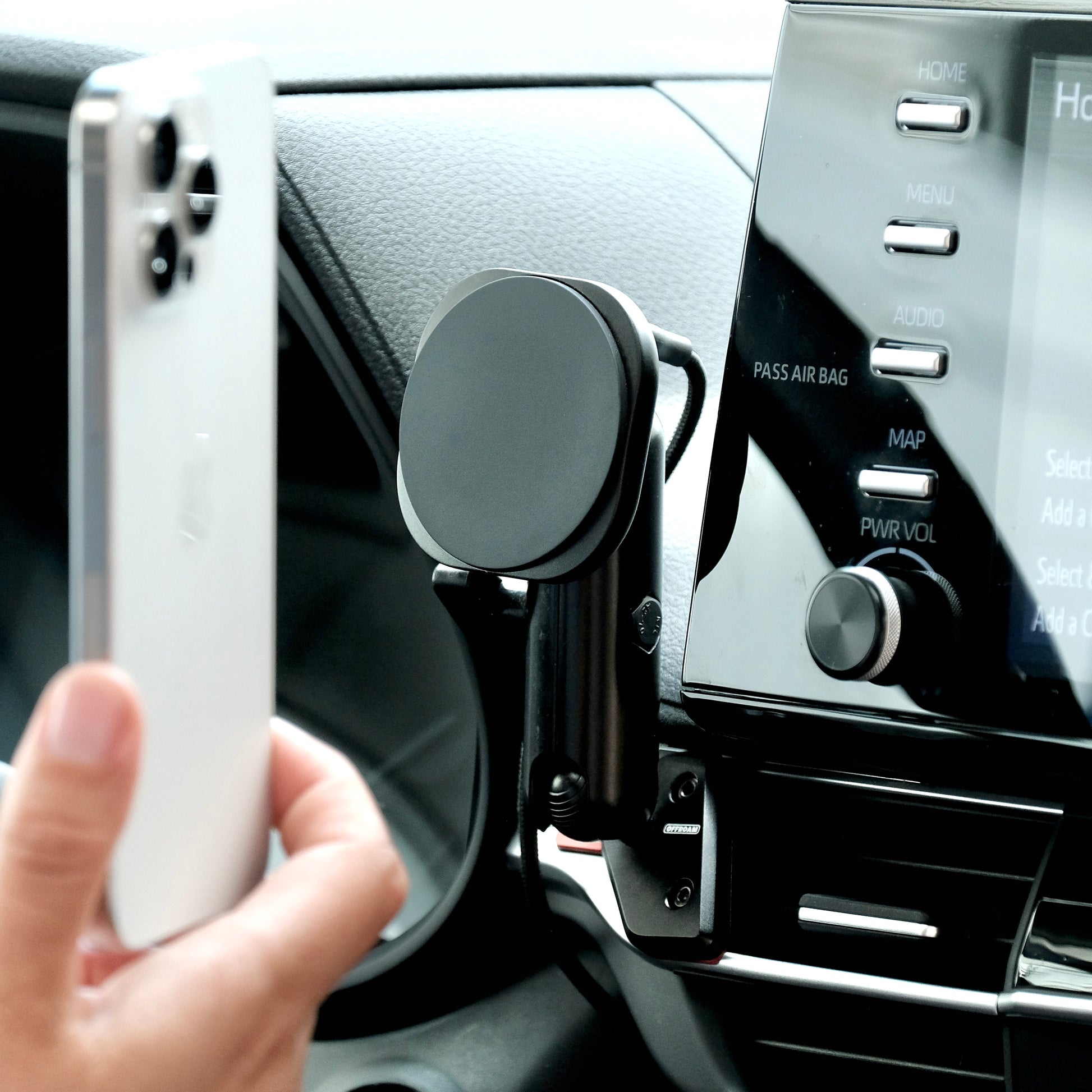 Image of Offroam MagSafe-compatible Phone Mount installed securely in Toyota Sienna 2021-2025. This premium phone mount installs easily without drilling or glue. High force magnets hold phone on any trail, road, or track. Perfect placement without blocking screens, driver view, or air flow. Fully adjustable positioning.