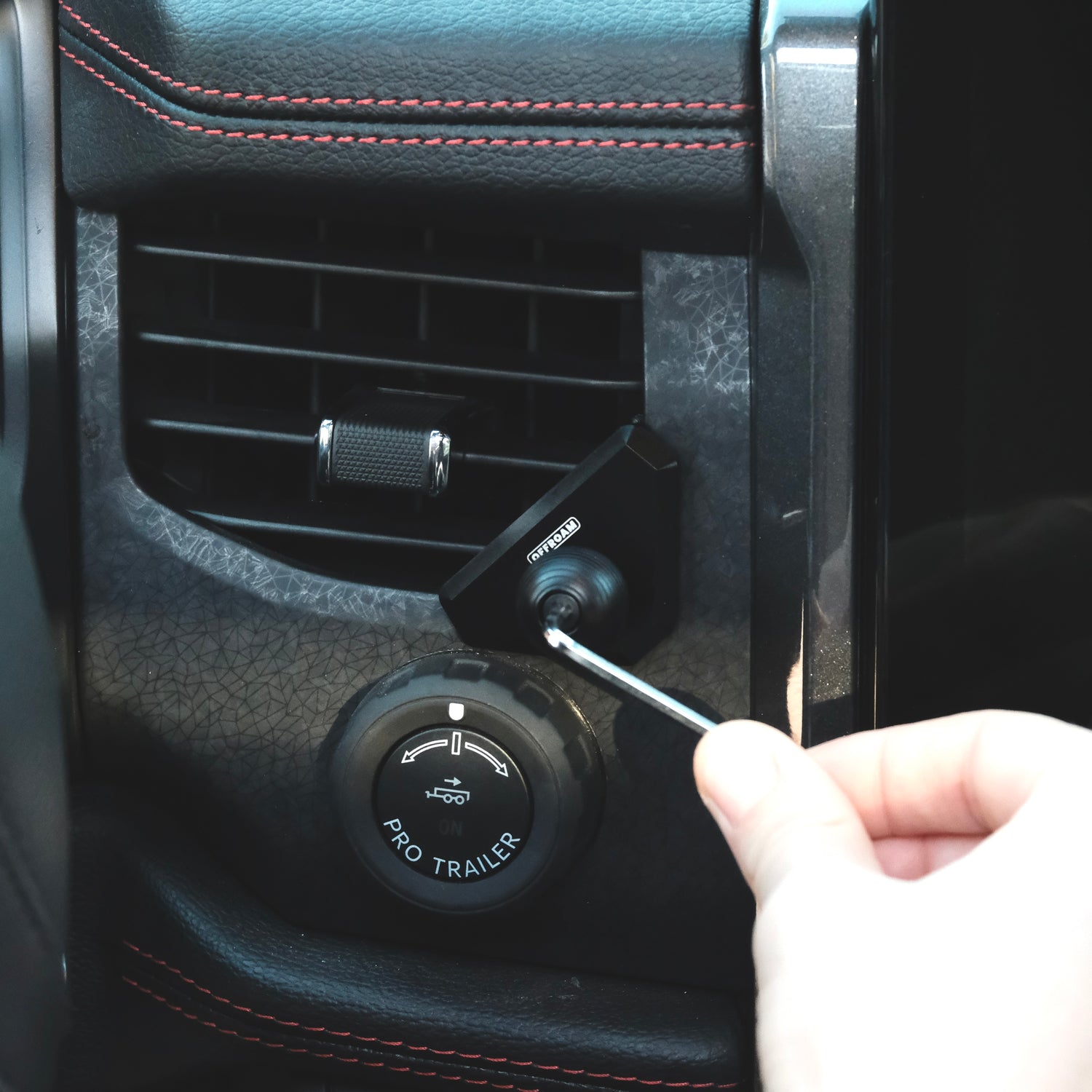 Image of Offroam Mounting Base installed securely in Ford F-150 Lightning 2022-2025 (Lariat & Platinum) | Expedition 2022-2024. This premium all metal phone mounting base installs easily without drilling or glue. Perfect placement without blocking screens, driver view, or air flow.