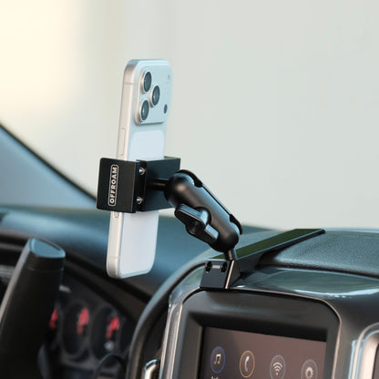 Image of Offroam Phone Mount installed securely in Chevrolet Silverado 2019-2026 | Silverado HD 2020-2026 & GMC Sierra 1500 2019-2026 | Sierra HD 2020-2026 with 7-in.|8-in. display. This premium phone mount installs easily without drilling or glue. Spring loaded Universal holder for use with any phone. Perfect placement without blocking screens, driver view, or air flow. Fully adjustable positioning.
