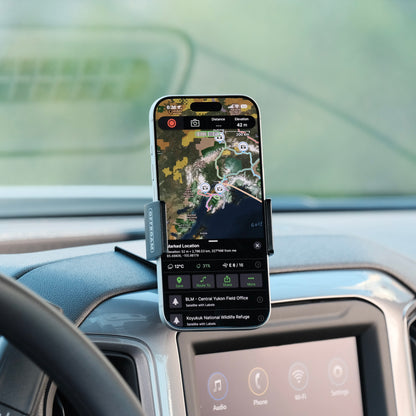 Image of Offroam Phone Mount installed securely in Chevrolet Silverado 2019-2026 | Silverado HD 2020-2026 & GMC Sierra 1500 2019-2026 | Sierra HD 2020-2026 with 7-in.|8-in. display. This premium phone mount installs easily without drilling or glue. Spring loaded Universal holder for use with any phone. Perfect placement without blocking screens, driver view, or air flow. Fully adjustable positioning.